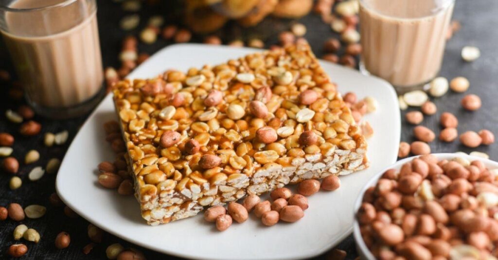 Lonavala chikki tea and local snacks on a wooden table